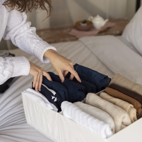 hands-holding-shirts-close-up